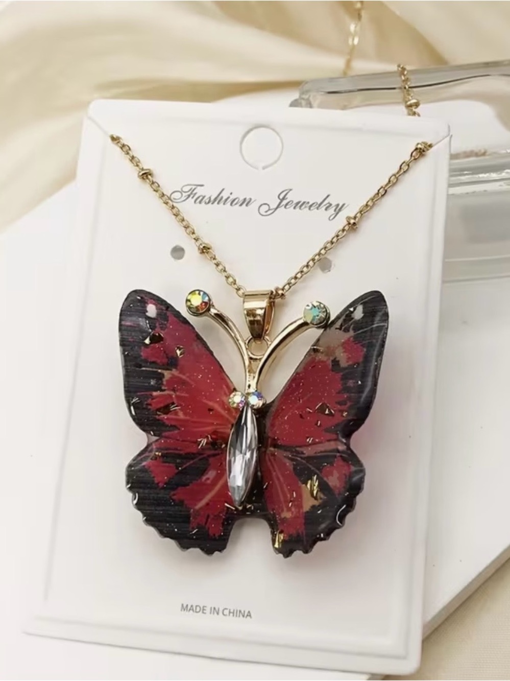 NWT Gold Butterfly Necklace with Red and Black Wings